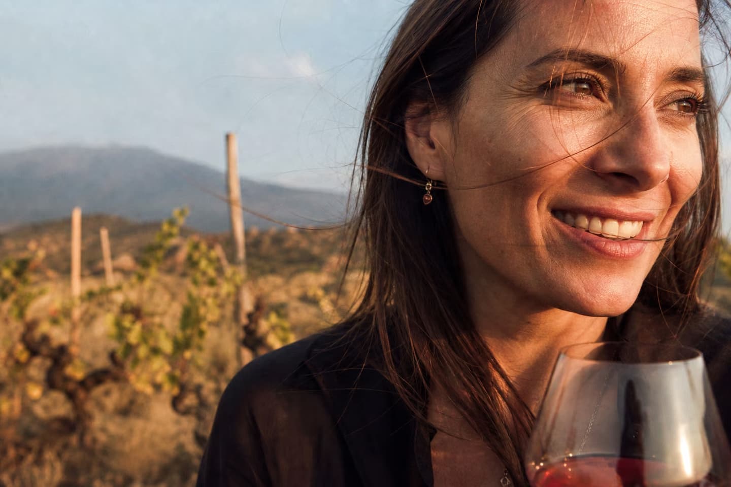 A woman smiling in warm Sicilian light