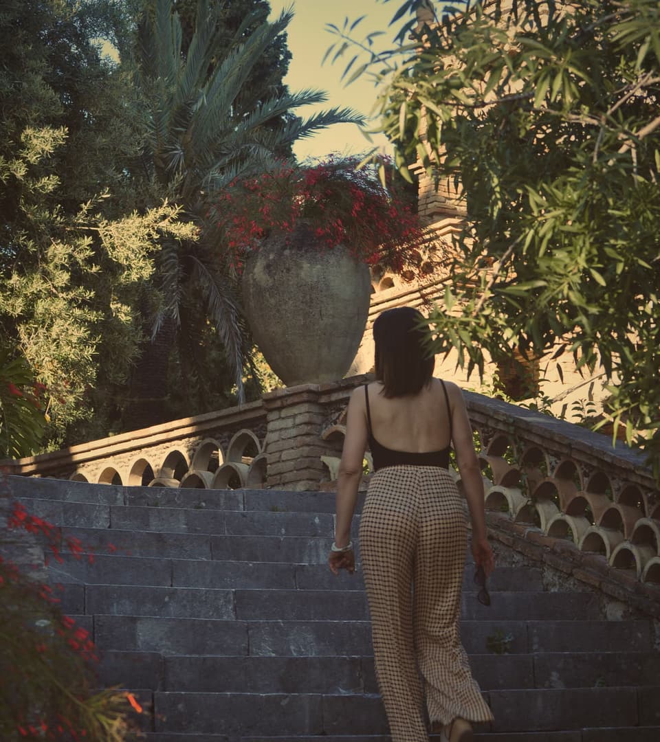 Silvia walking through a Sicilian garden